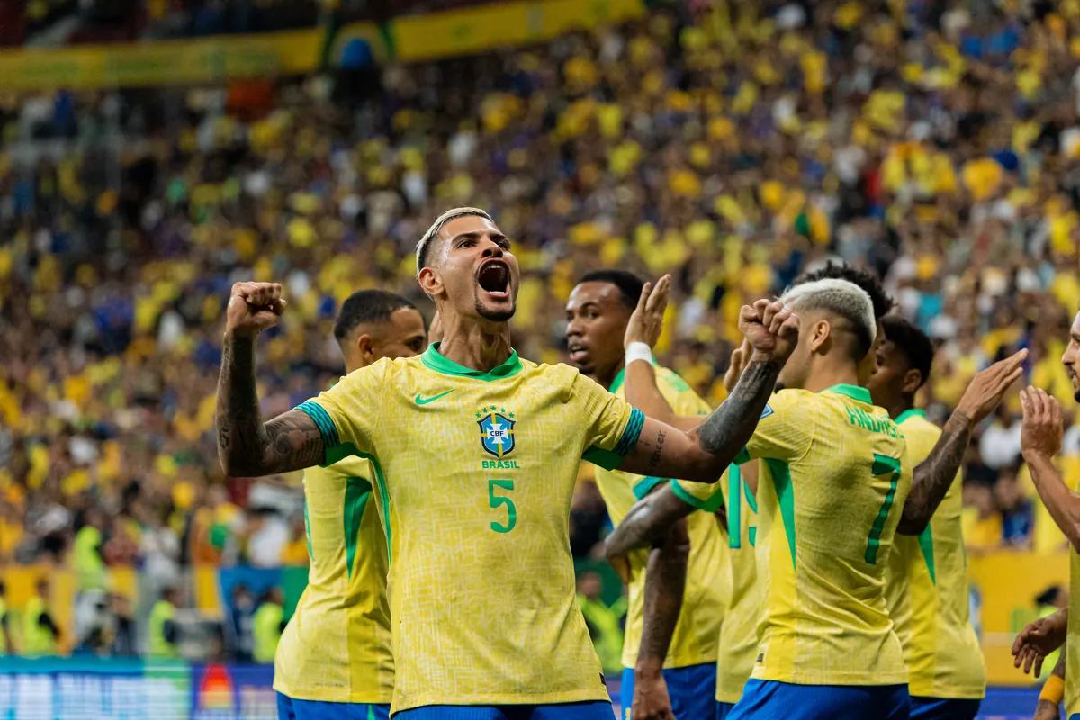 Brazil players celebrating a goal in front of the home crowd