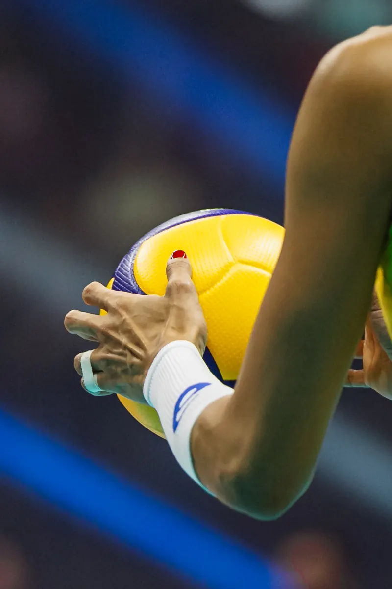 Close up of a volleyball held before the serve